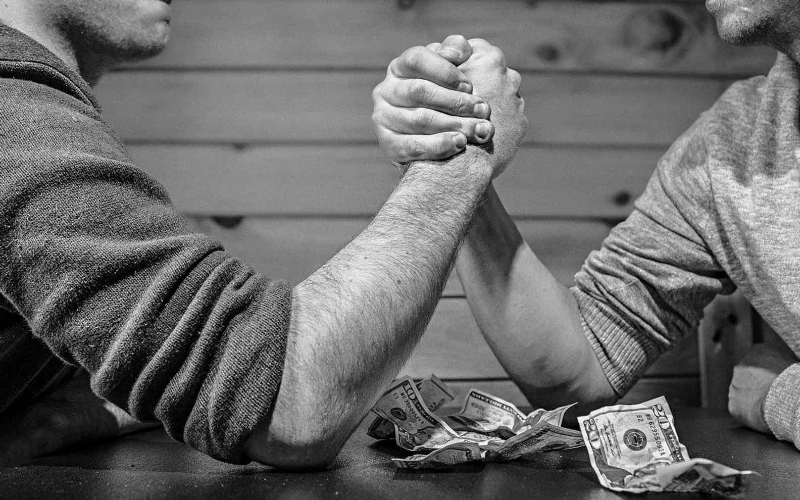 Arm wrestling, bet and monochrome