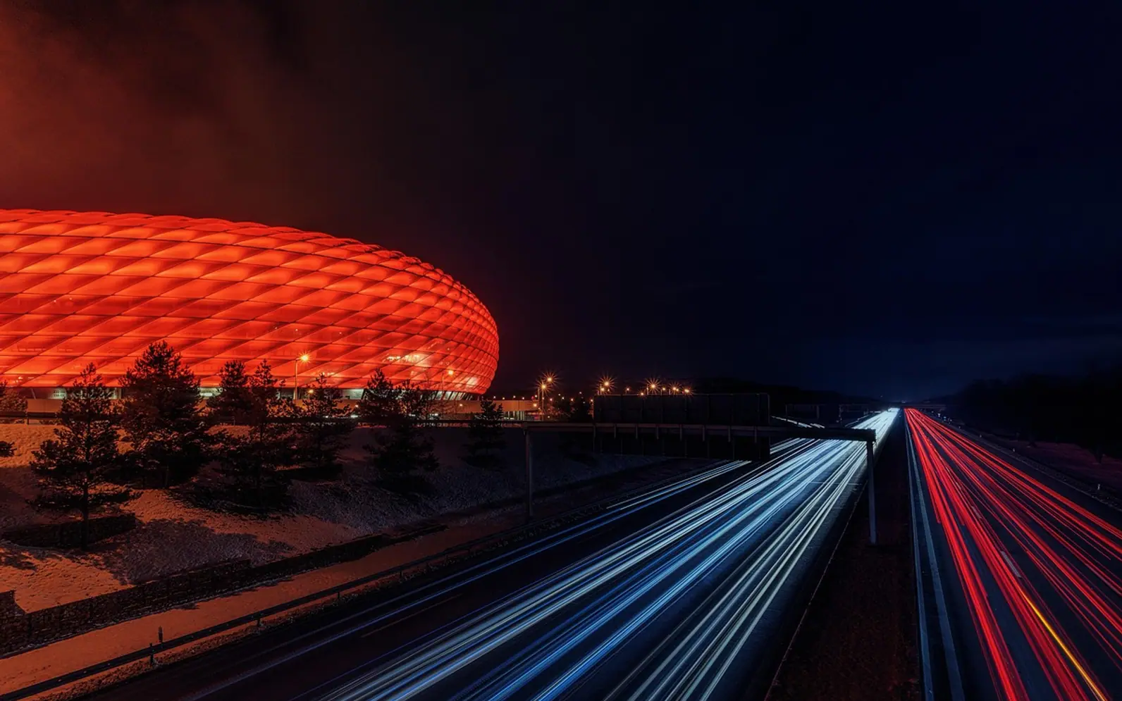 Football stadium, highway and night